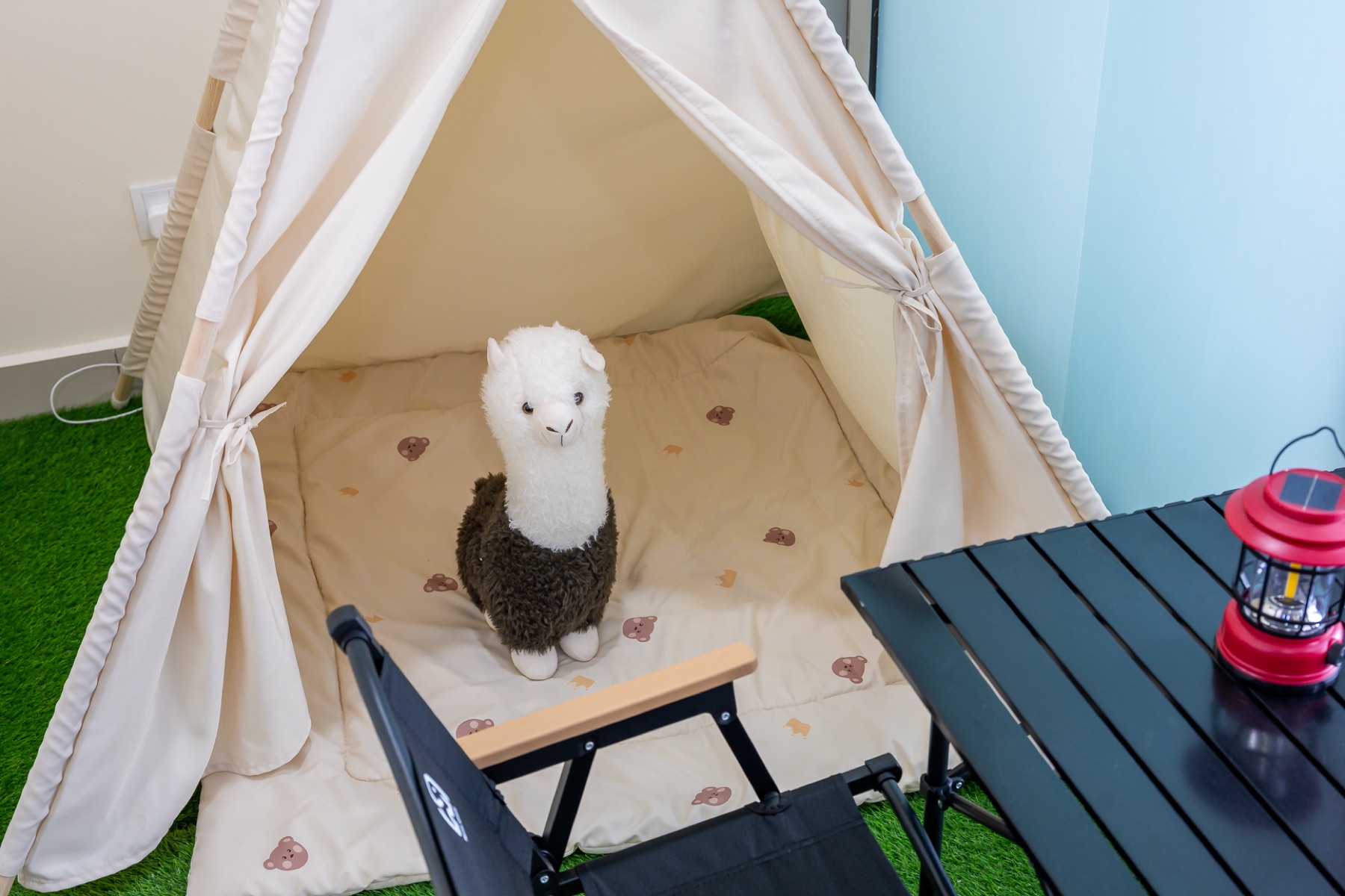 Family-friendly indoor camping feature in a managed unit at 3 Elements Seri Kembangan